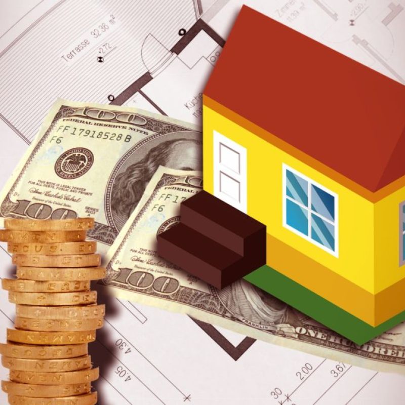 A stack of coins, dollar bills, and a model house placed on top of architectural blueprints highlights costs related to plumbing and air conditioning.