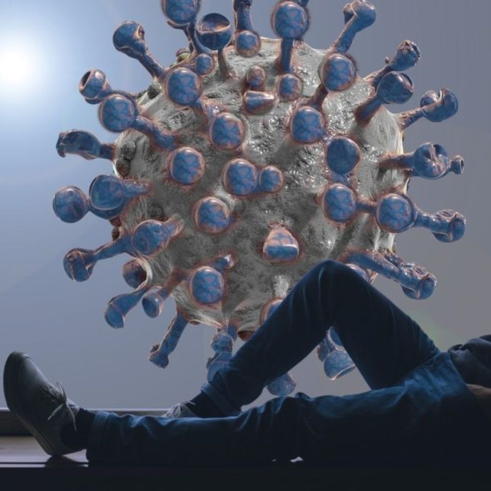 A man sits by a window, looking at a large, digitally rendered virus particle outside, symbolizing concern or isolation during a pandemic and reflecting on the importance of HVAC and air conditioning in maintaining indoor safety.