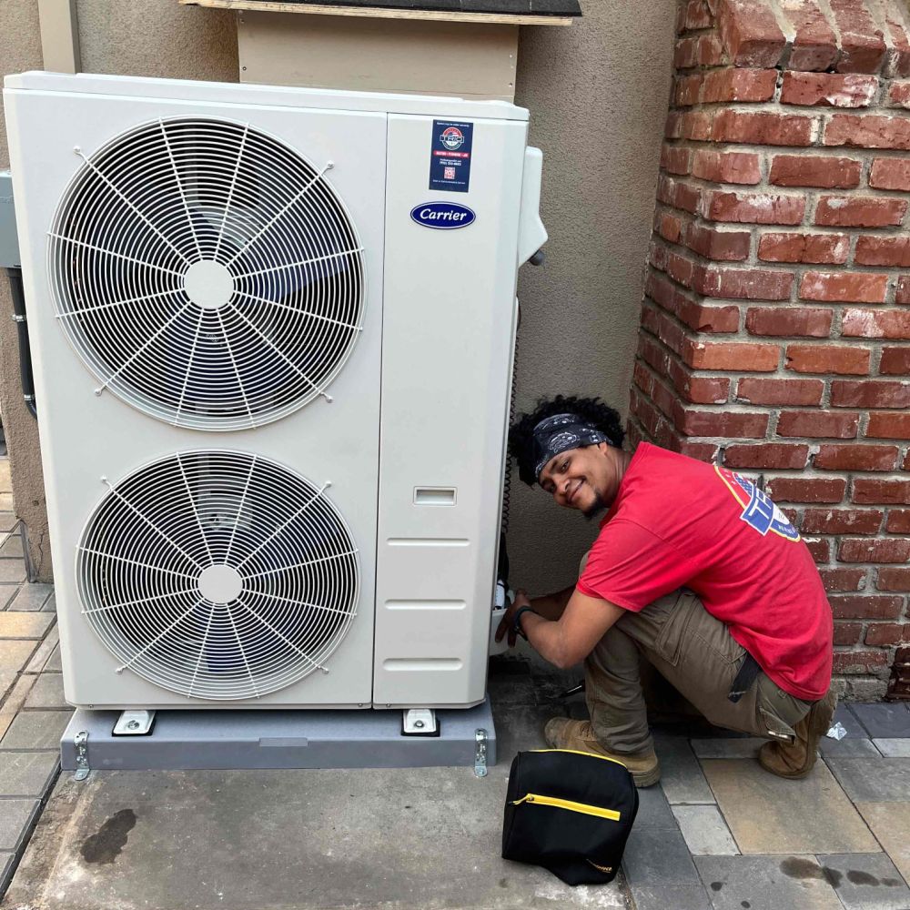 Red outline icon of an air conditioning unit with a fan, accompanied by a figure wearing a cap, representing HVAC technician or air conditioning and heating service.